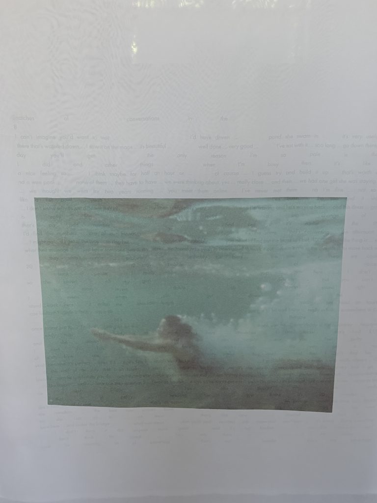 Photograph of a woman swimming underwater with cascade of bubbles behind her. Artist: Louise Barrett.