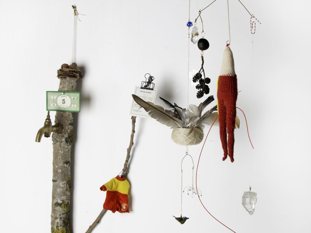 Photograph of installation of found objects including feathers, plant material, paper and textile fragments, titled 
Yura² – Fragile Balance
Artist: Naori Priestly
